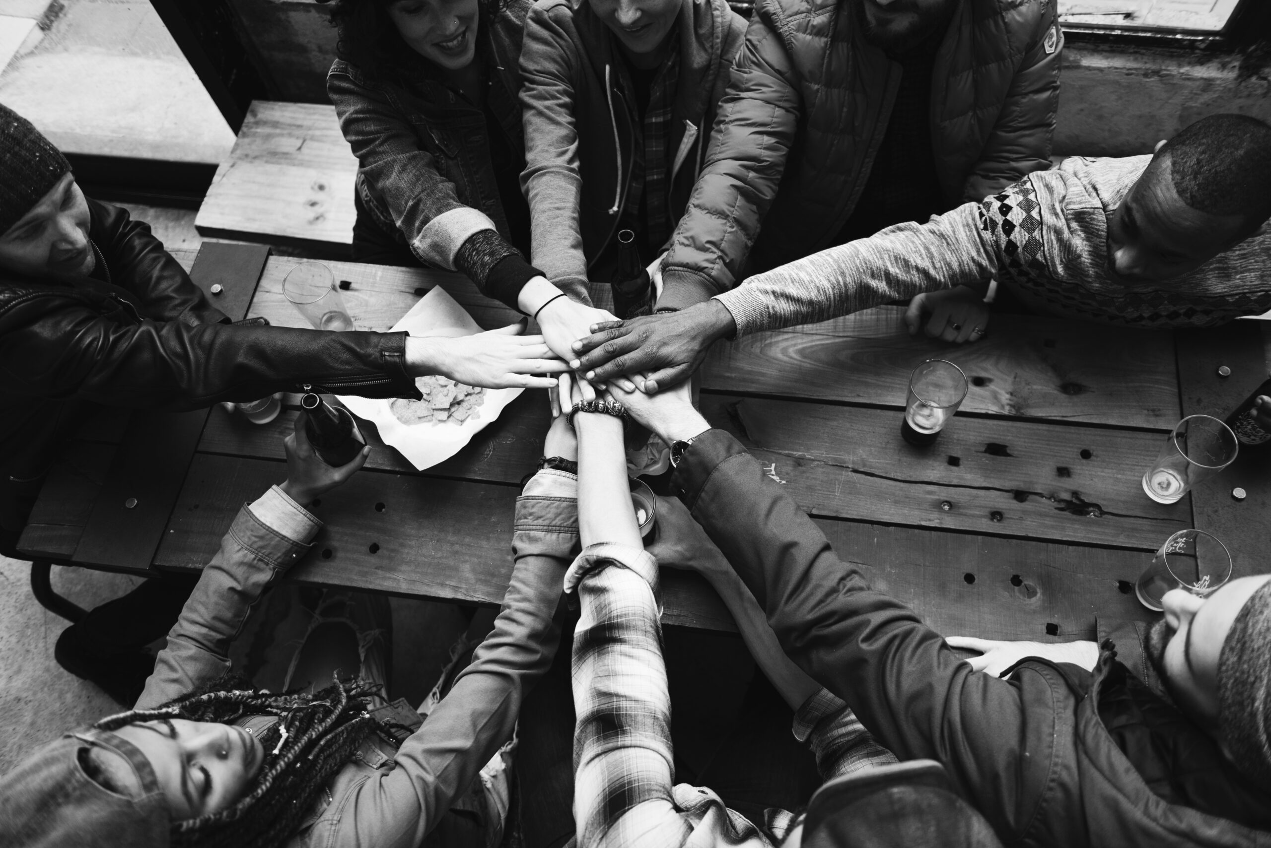 Group of friends stacking hands